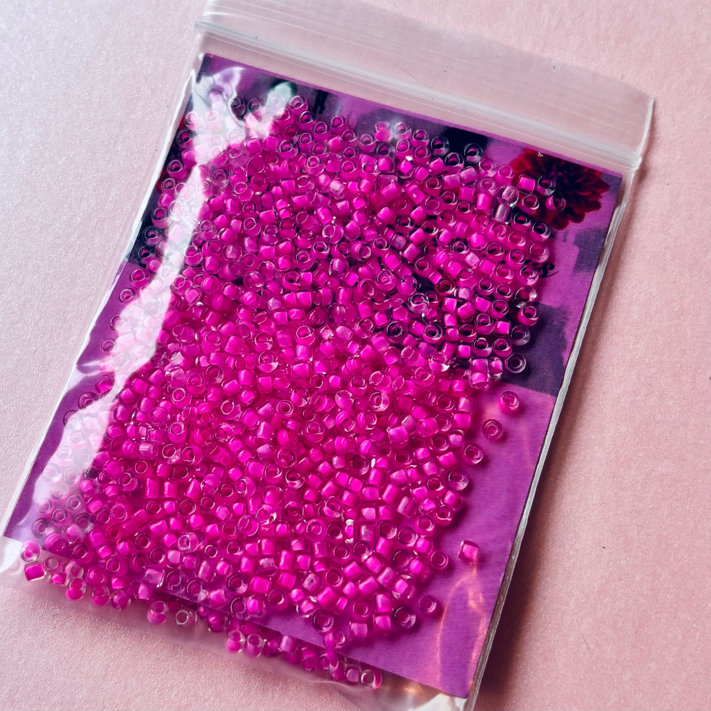 10 grams of Clear Pink Lined 12/0 Seed Glass beads