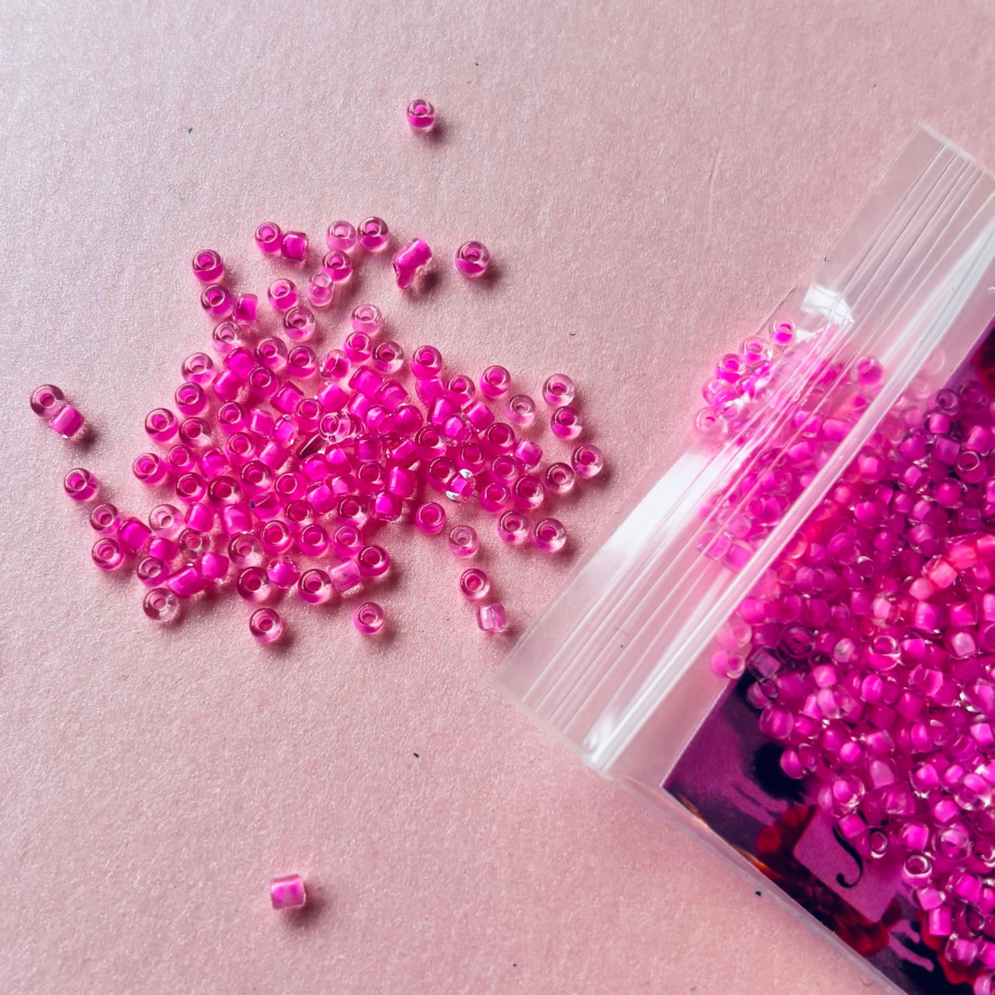 10 grams of Clear Pink Lined 12/0 Seed Glass beads
