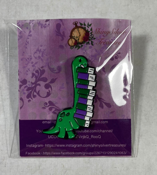 Dinosaur carrying books enamel pin badge with rubber back