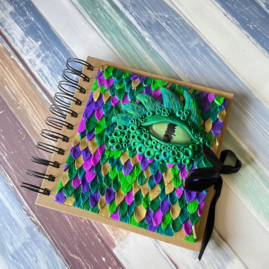 Clay book ‘Through the Dragons Eye’ 6x6 journal sketch book with a handmade polymer clay cover